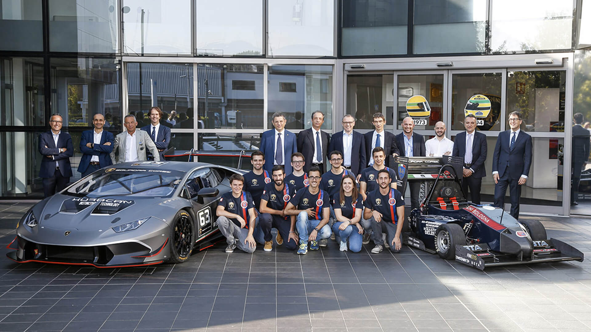 group of students near a car