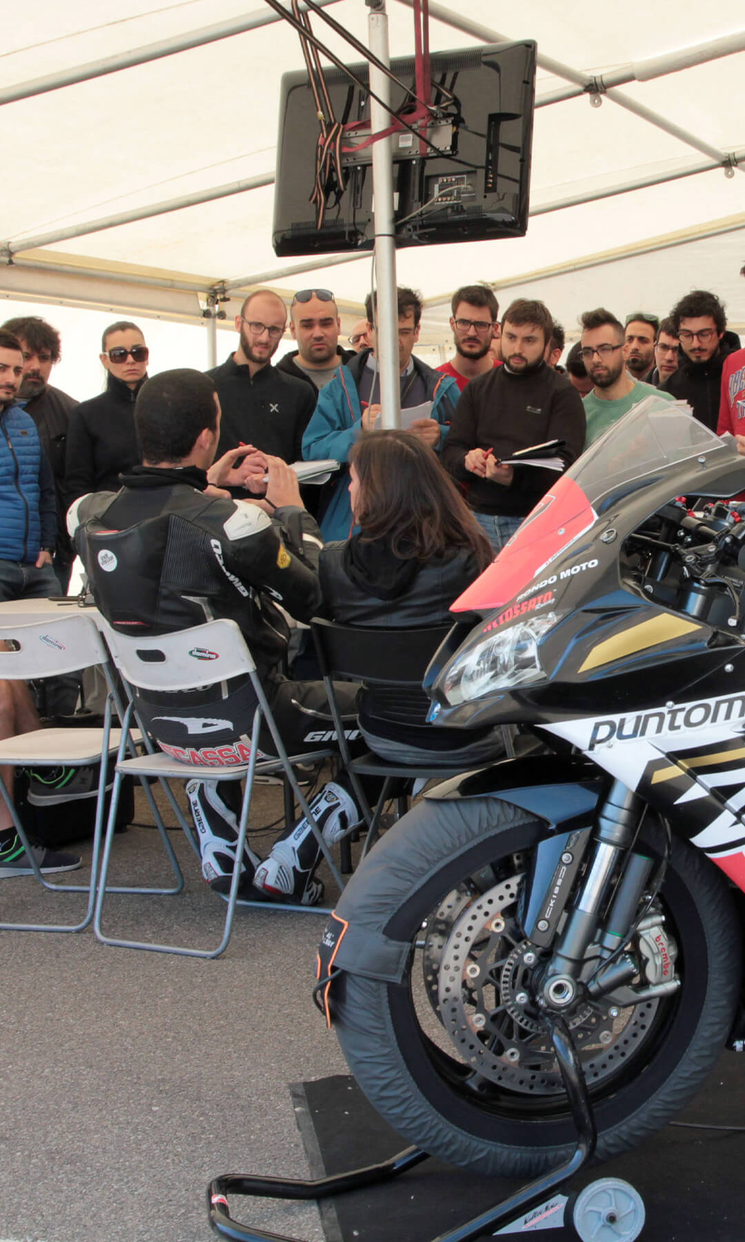 Motorcycle master students in a group with the pilot
