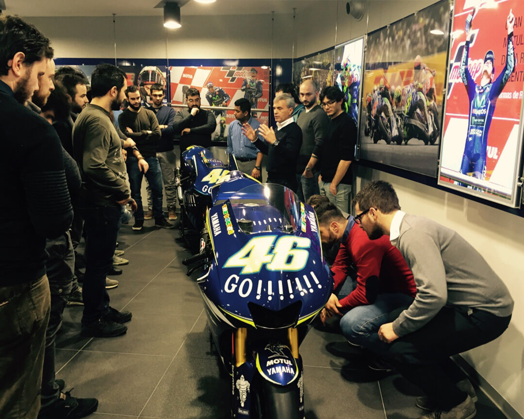 motorcycle master lecturer with students around the motogp of Valentino Rossi