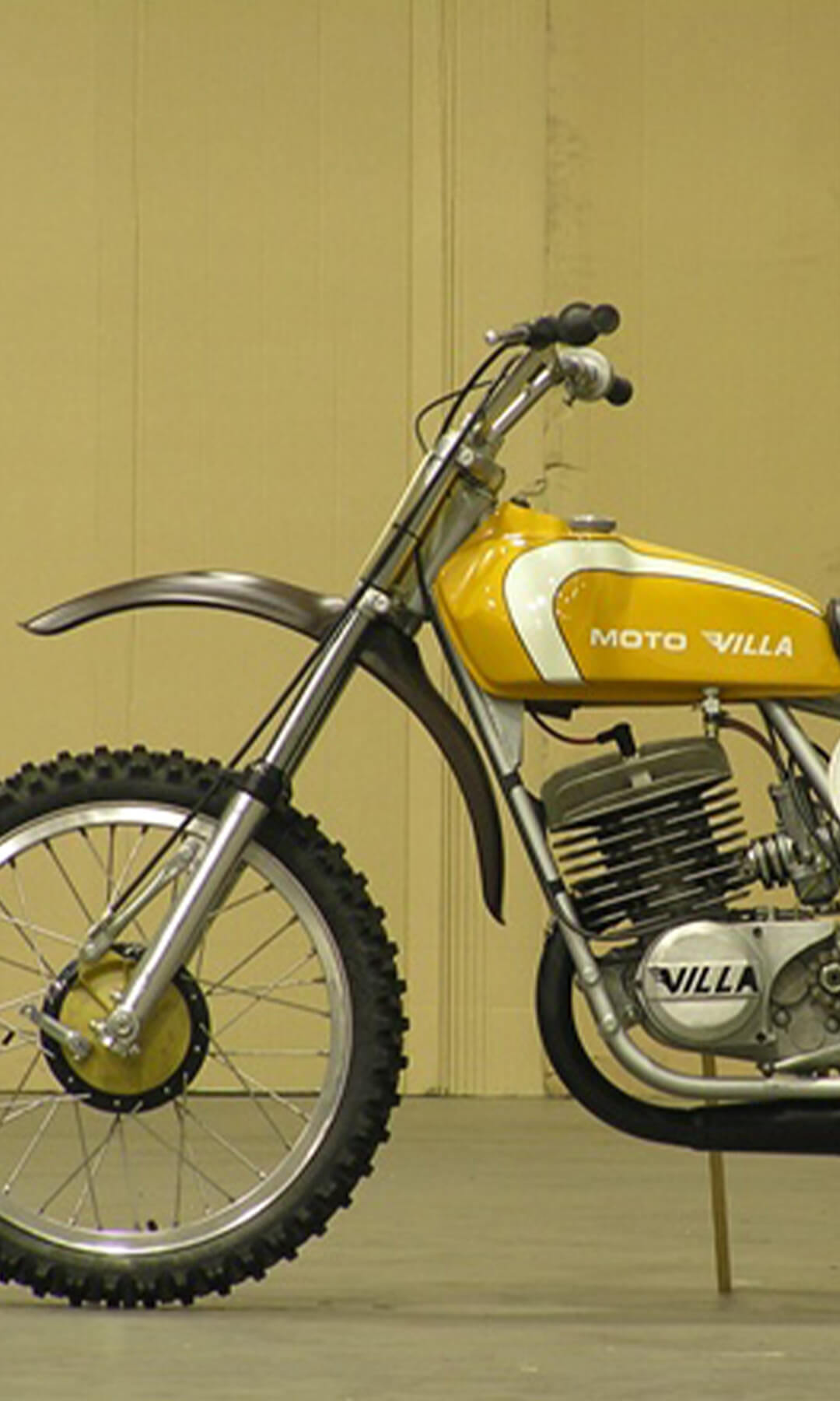 Left side view of a vintage dirt bike from the villa italia collection
