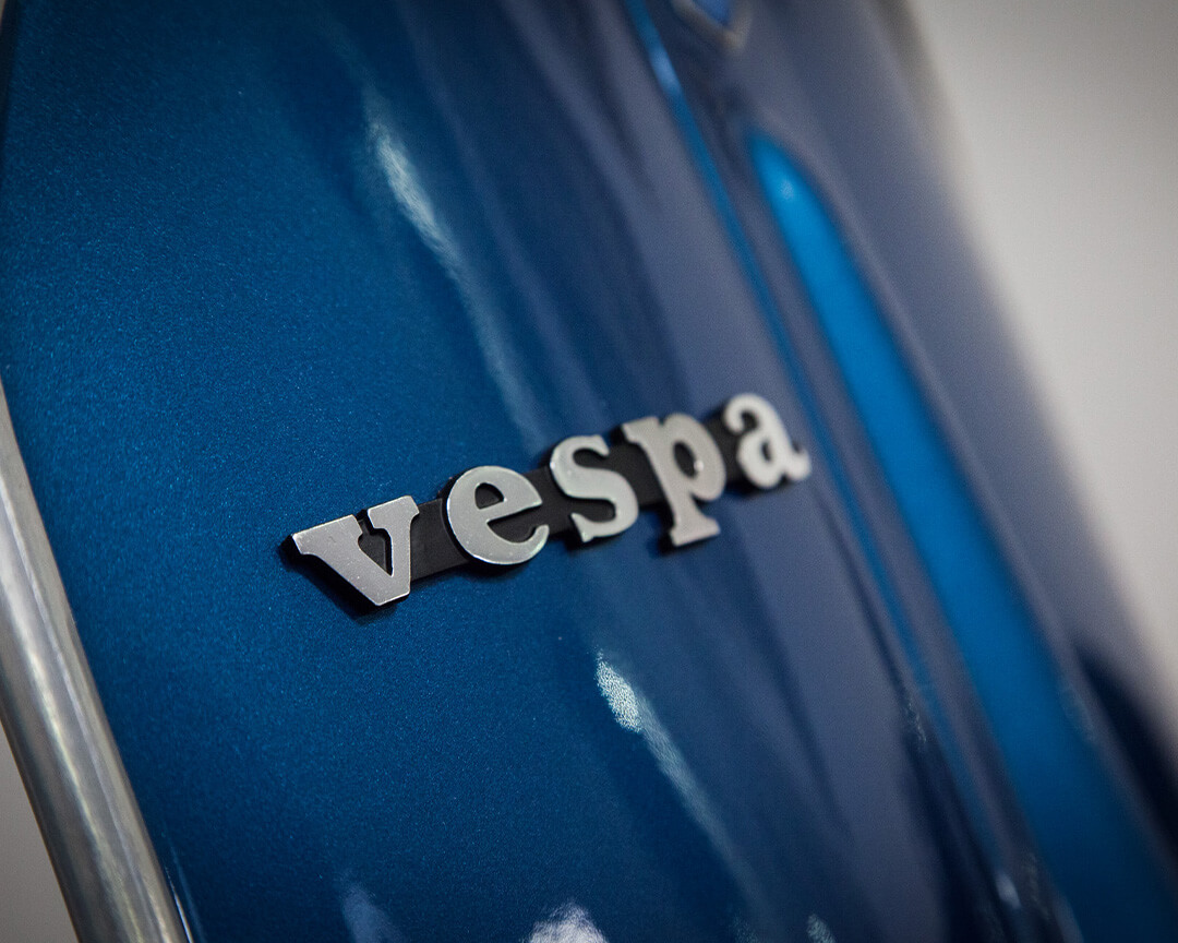 detail on blue wasp shield with logo