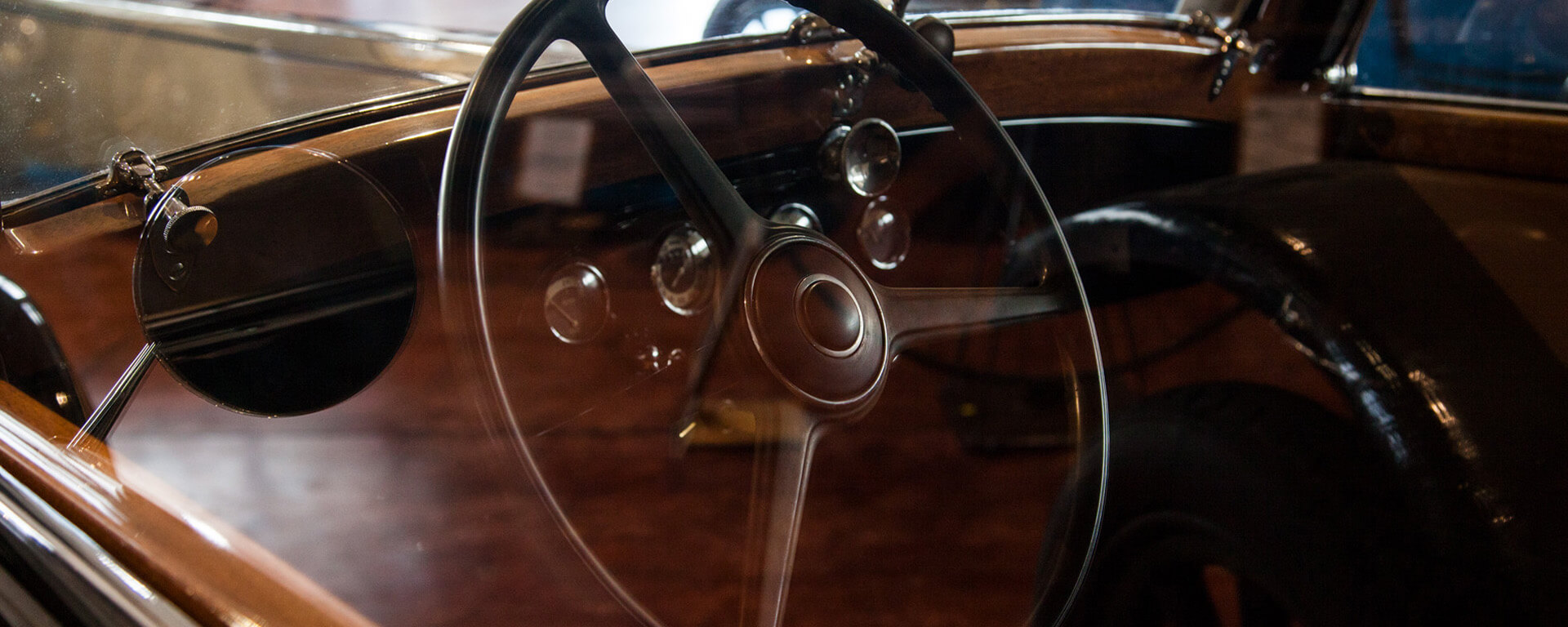 Dashboard and steering wheel of a classic car, part of the collection of the museum of san martin in rio