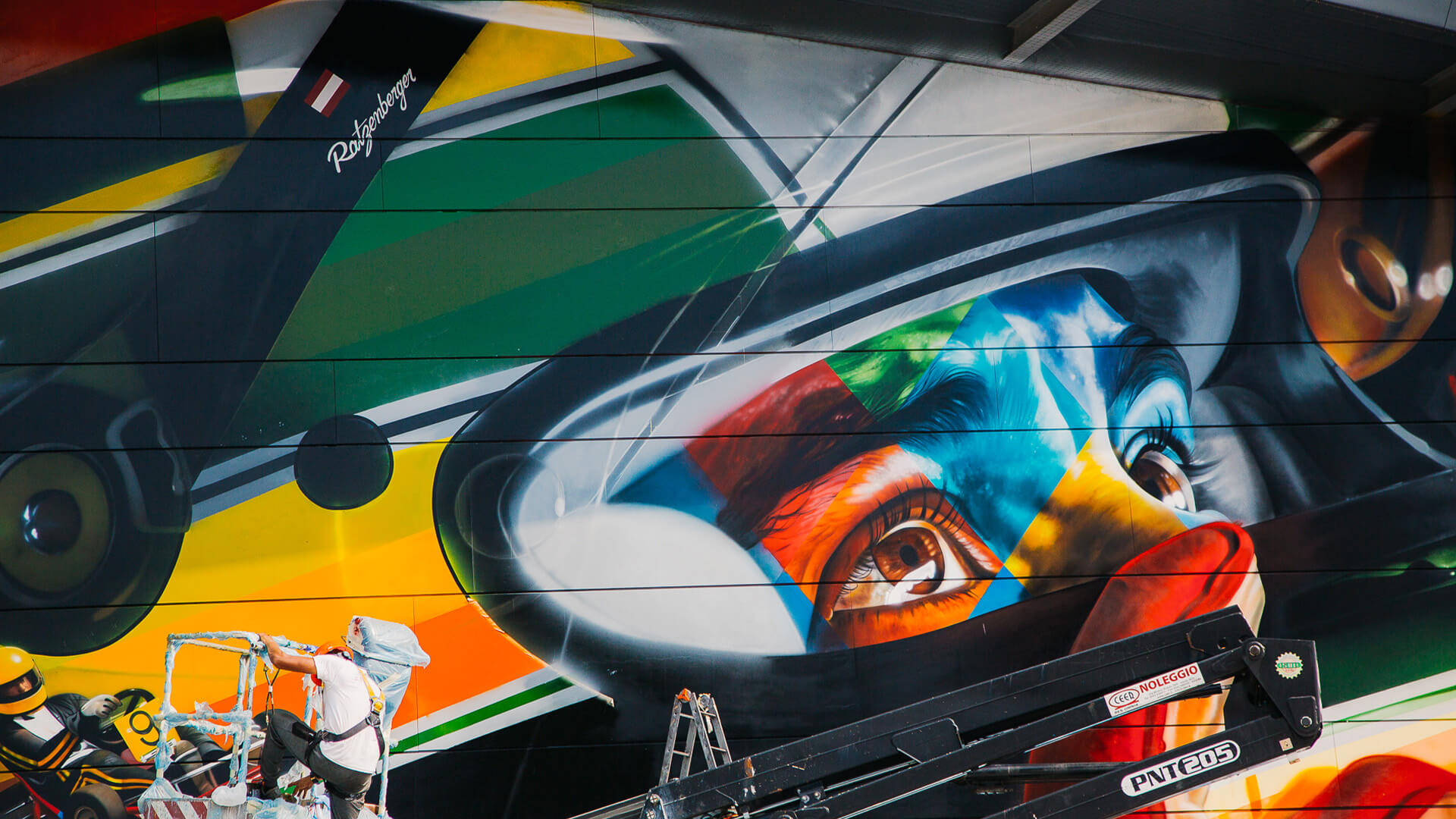 Detail of eye and parts of helmet with graffito technique of motorcycle rider with bright colors