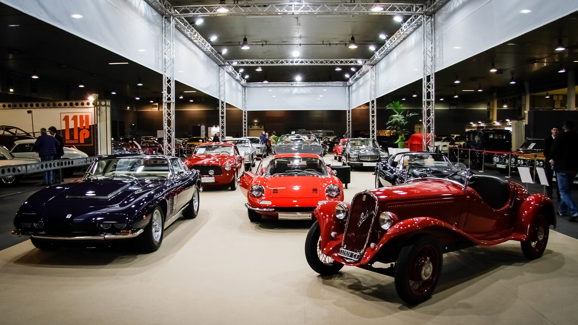 showroom with classic cars of various models and makes