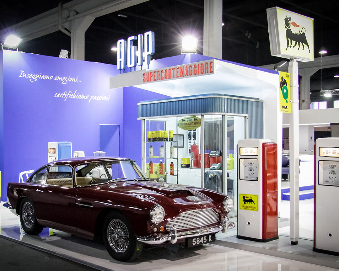 bordouex classic car displayed next to a model of an old petrol station