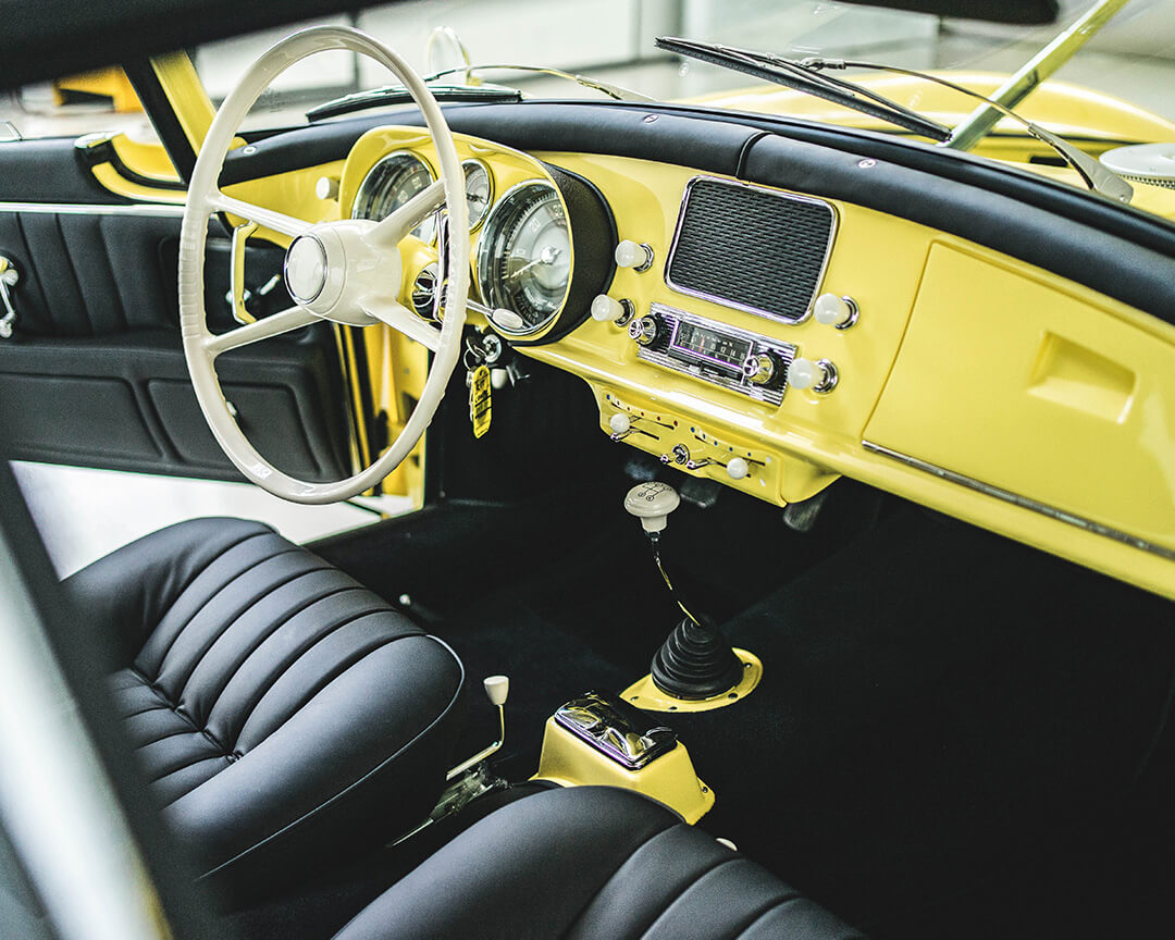 classic car interior in black leather with yellow details