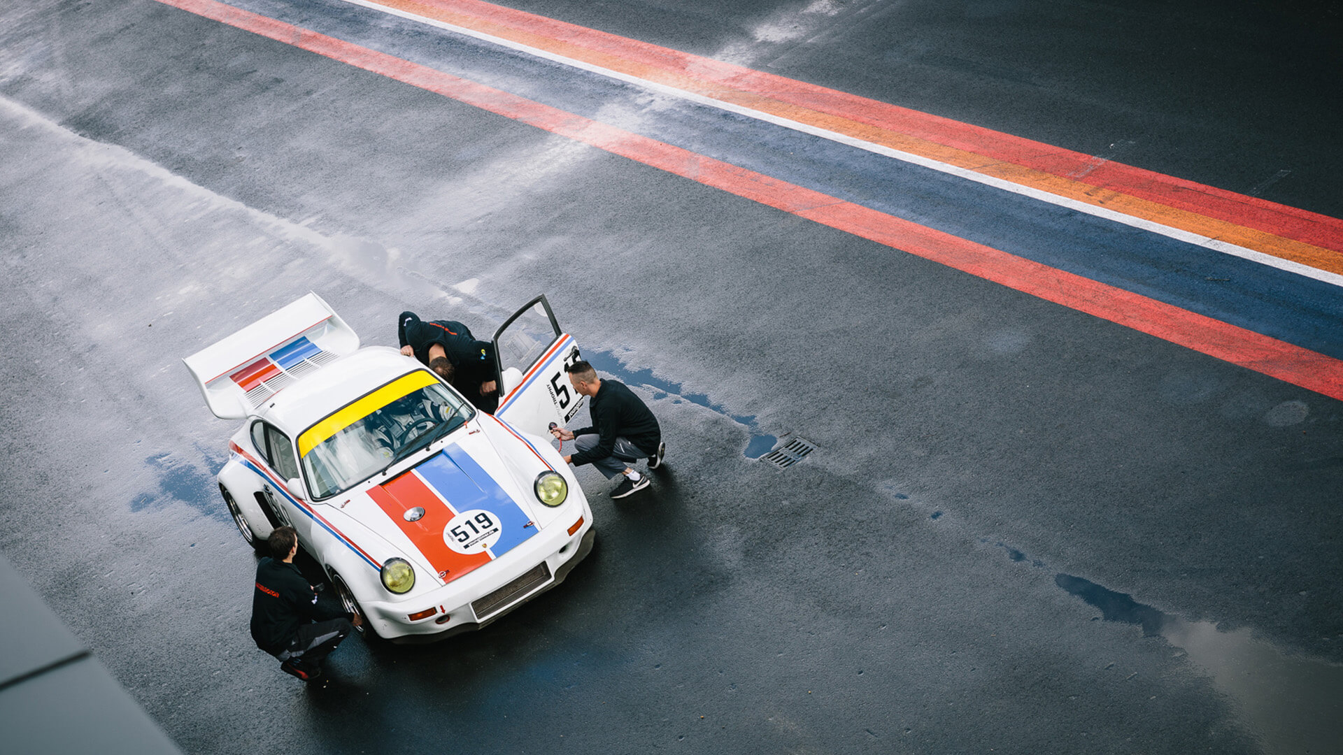 Vintage race car stopped on track with Colsam paint strips