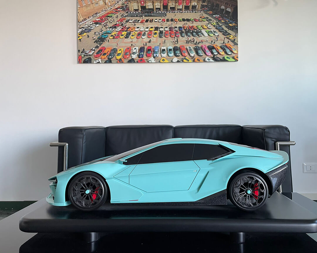 Model of an FD Group prototype, echoing the lines of a light blue Lamborghini Huracan