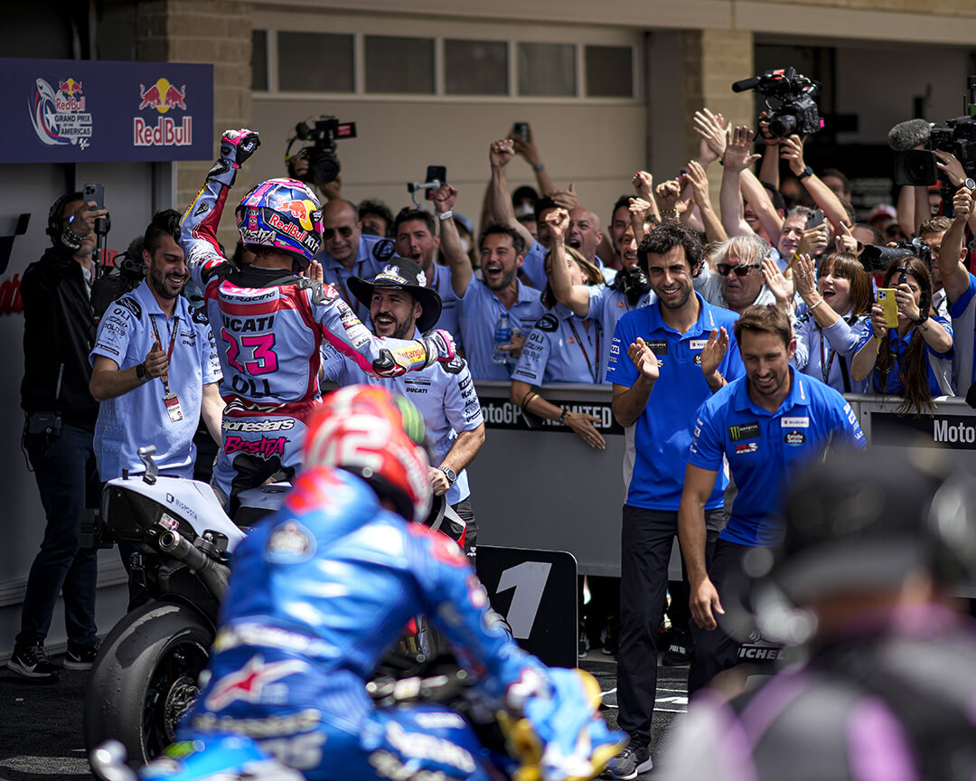 Gresini Racing rider Enea Bastianini exulting with his team riding his bike after taking the podium at the Grand Prix of the Americas in the MotoGp 2022 championship
