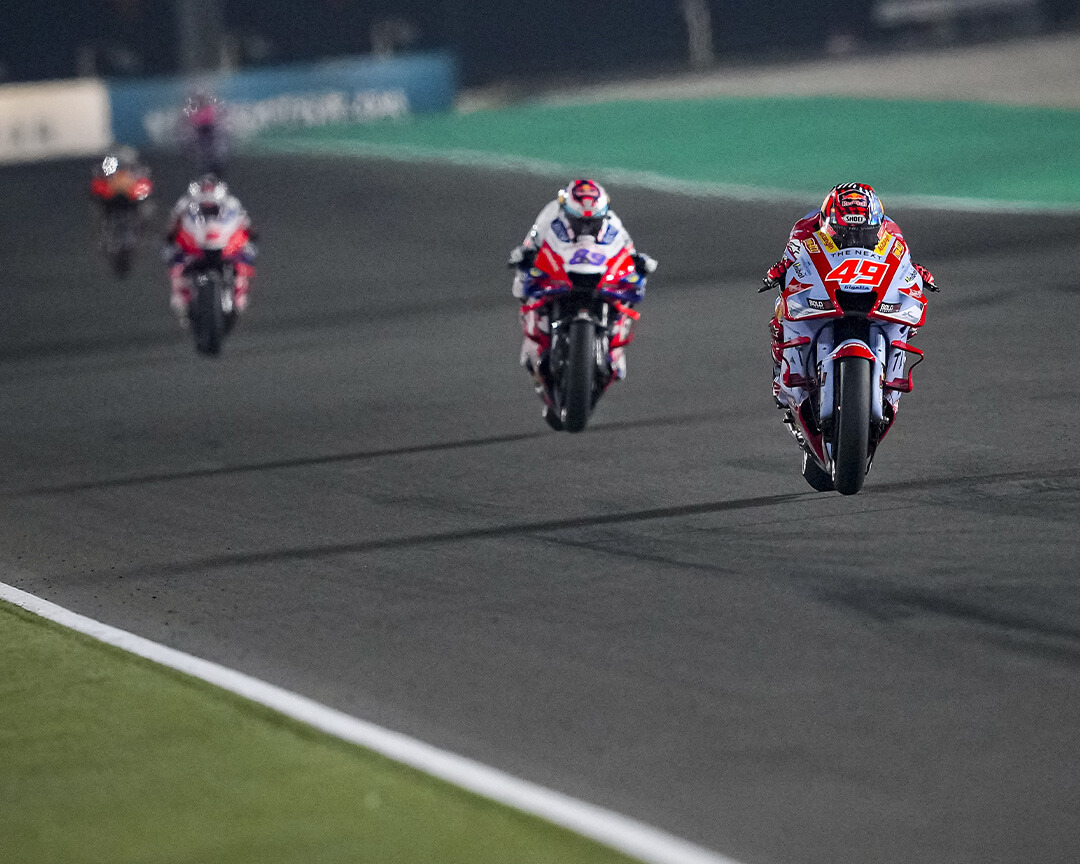 Gresini Racing rider Fabio Di Gianantonio with the number 49, riding his bike down a straight