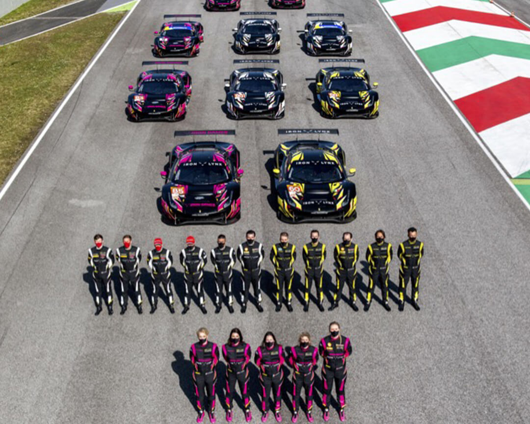 Iron Lynx drivers and cars posing in the middle of a straight for a top-down photo
