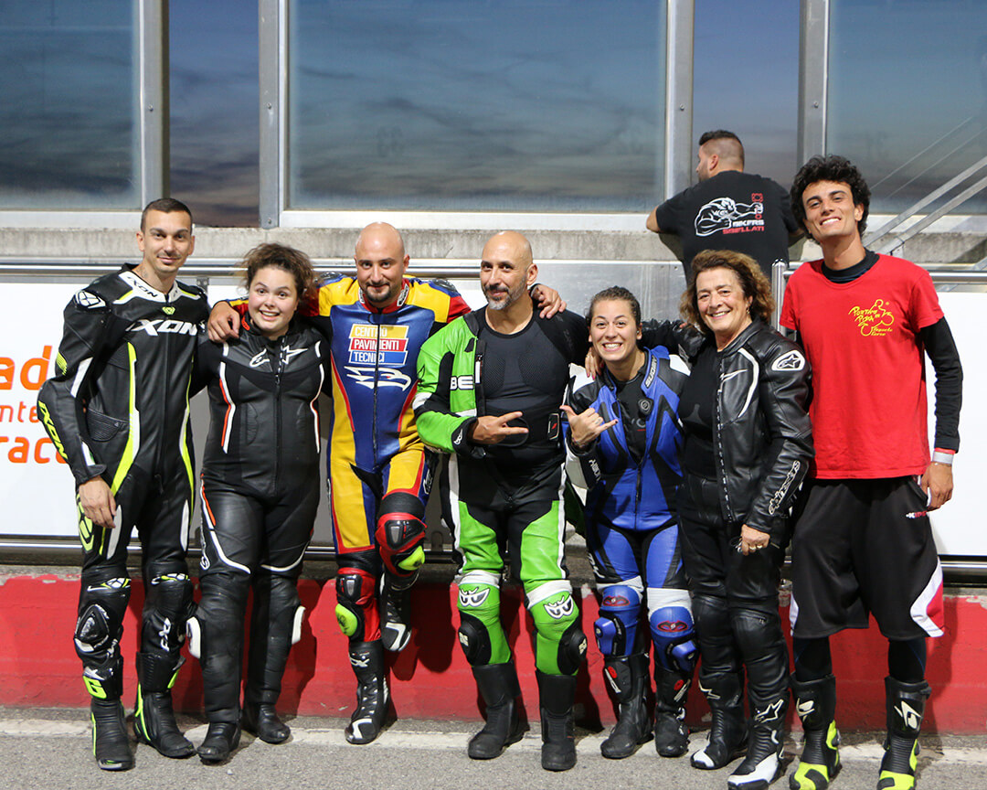 photos of both male and female drivers and teacher with red tshirt with Portami in Pista logo