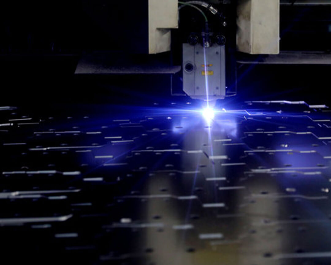 A vaccari e bosi machine uses a laser to cut a metal plate for the construction of a frame