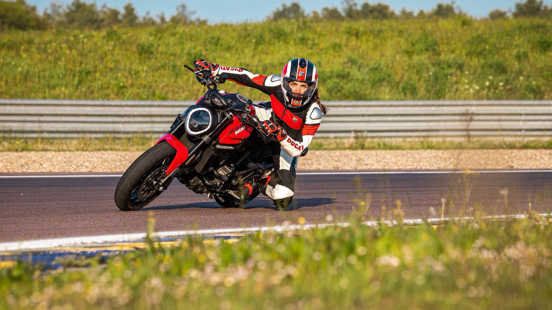 Chiara lovato that riding a ducati monster faces a curve