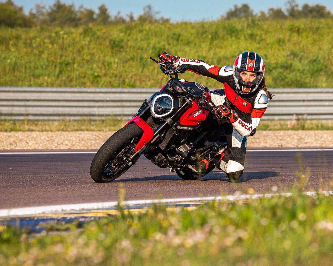 Chiara lovato that riding a ducati monster faces a curve