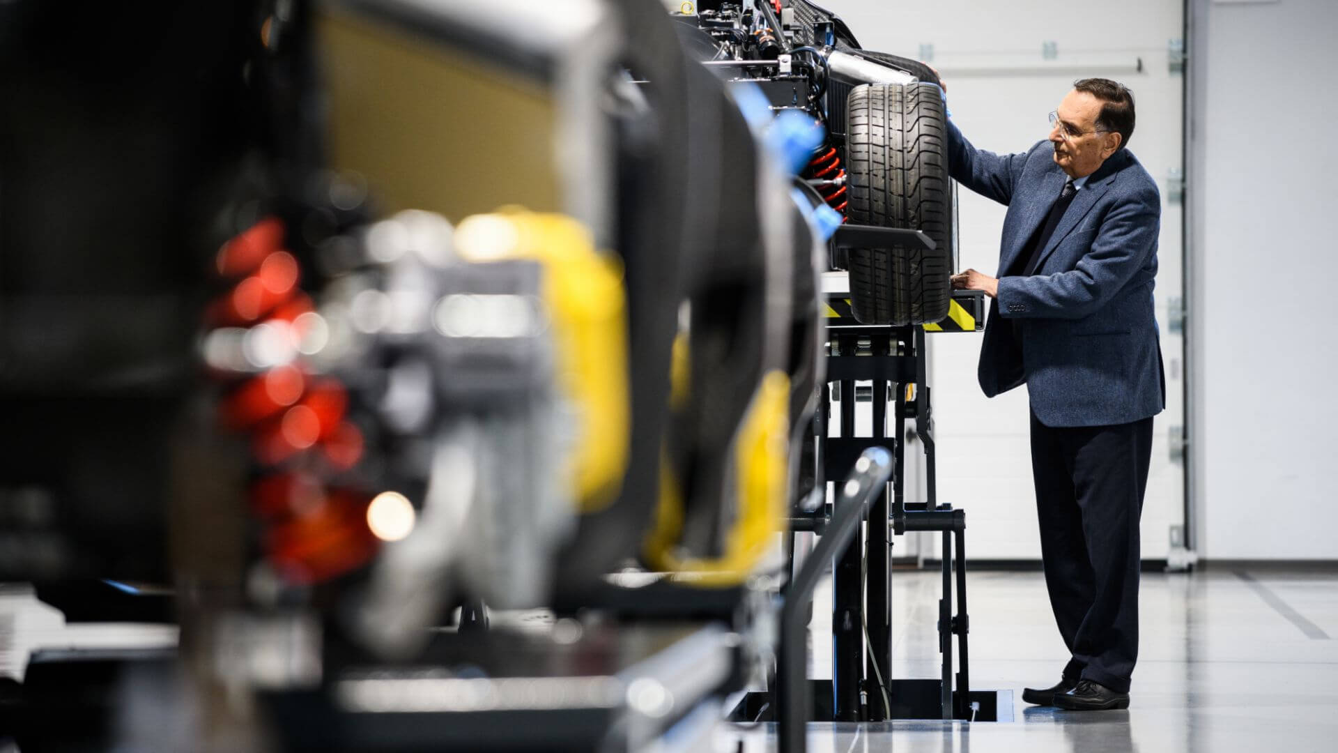 Gianpaolo Dallara observing car tyre in the testing phase