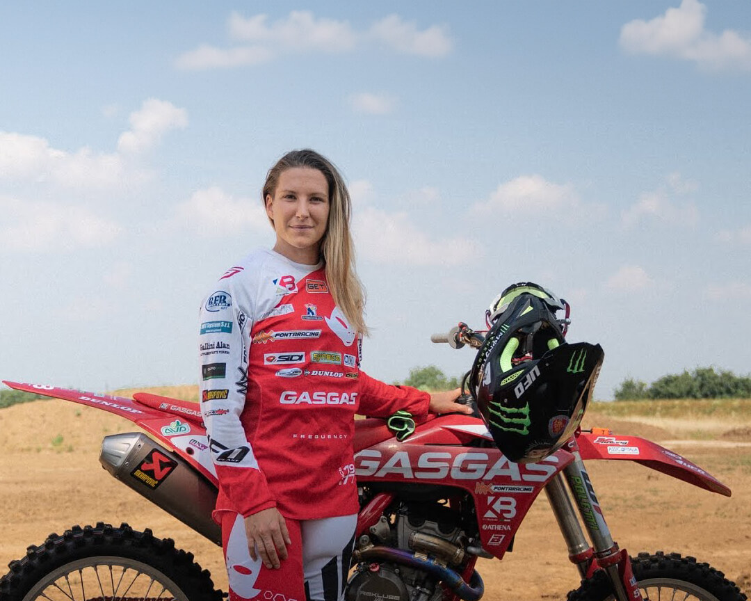 Kiara Fontanesi in racing gear, standing next to his cross bike GasGas