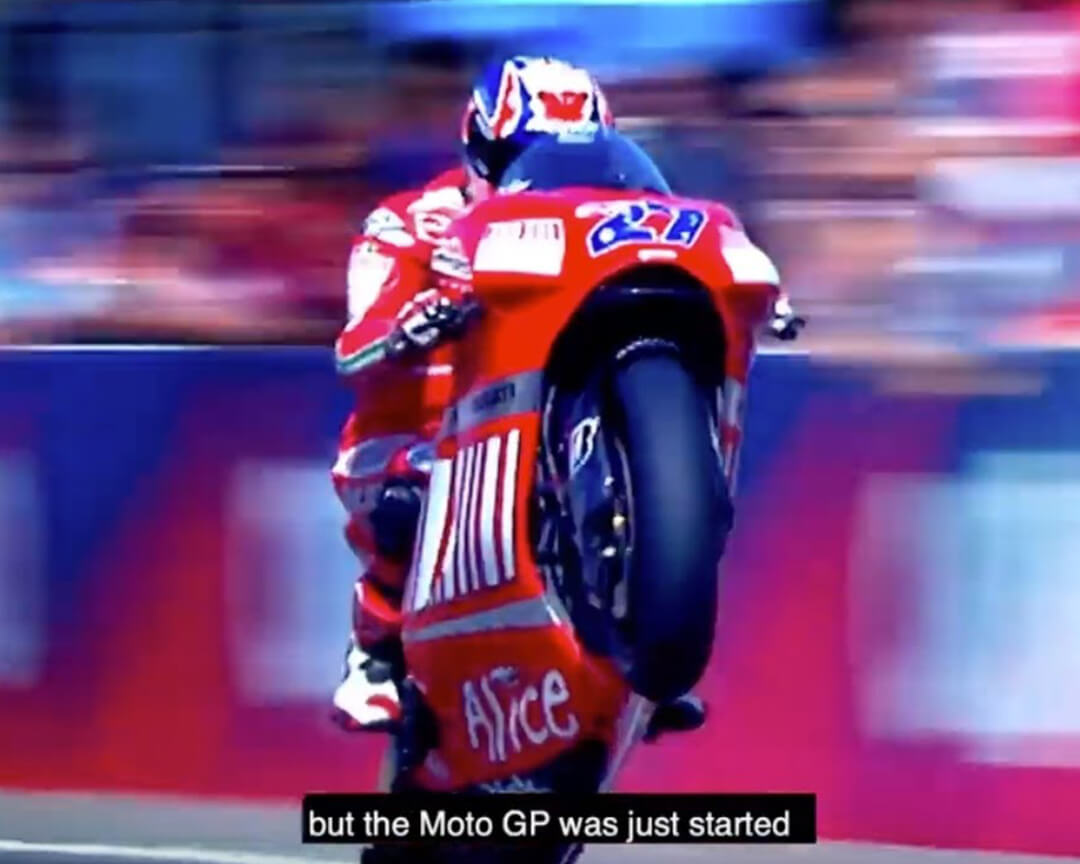 A motogp rider riding his motorcycle with the number 27 inpenna