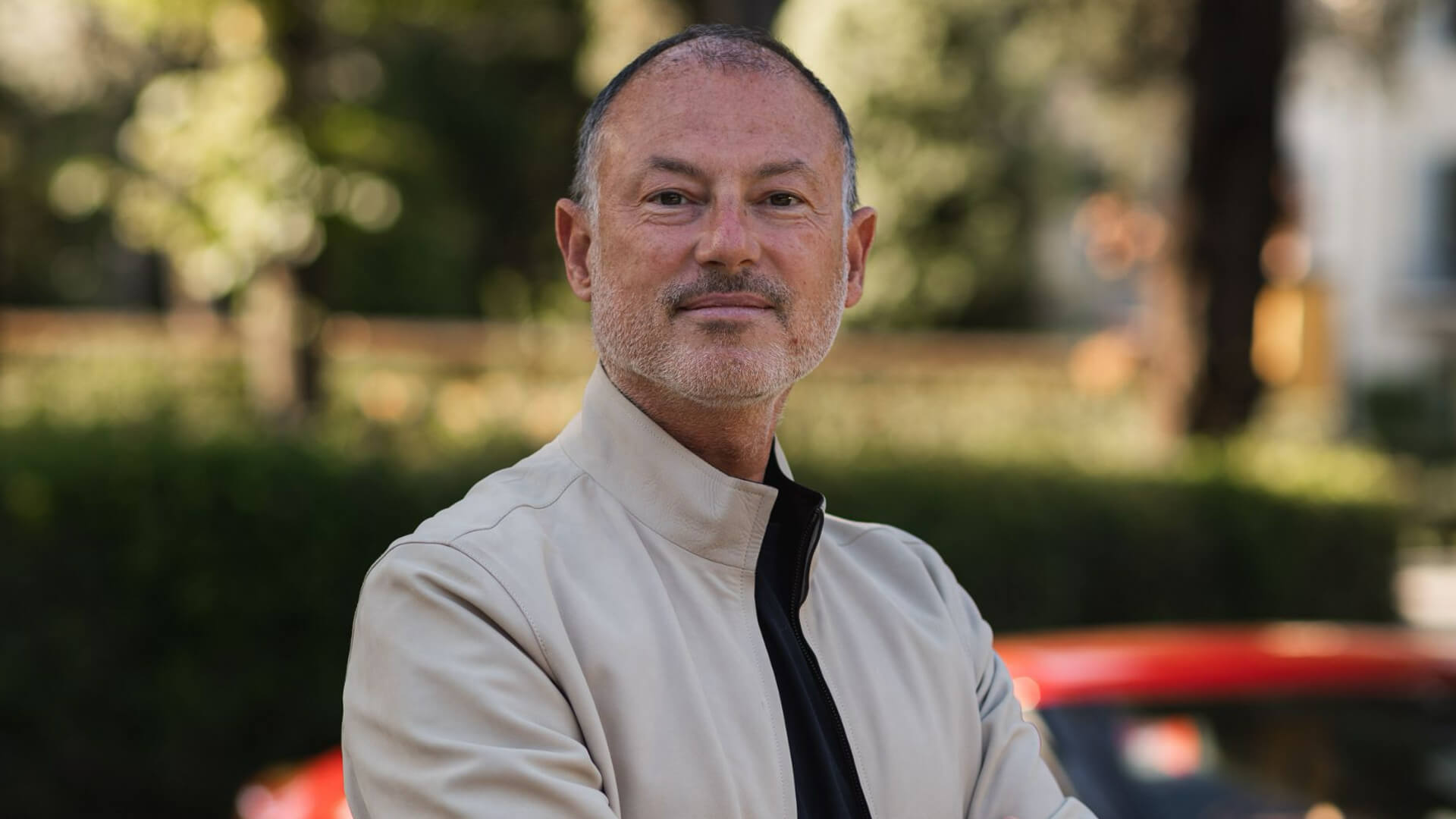 Luigi Orlandini posing for a photo with blurred background
