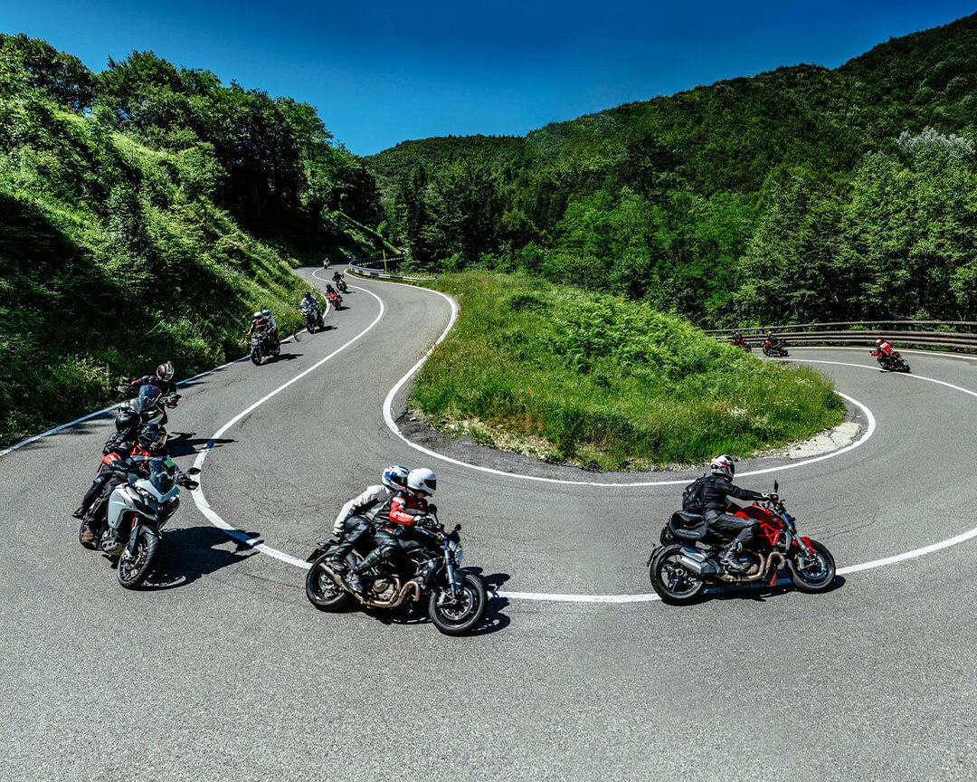Ducati motorcycle on mountain road hairpin bend