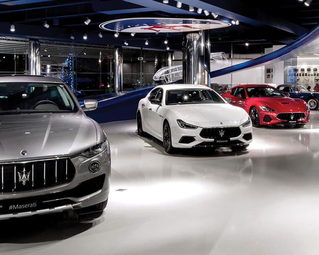 Entrance to the Maserati Factory, Cars on display.