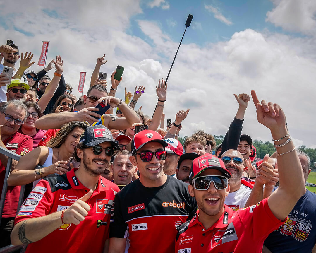 Pecco Bagnaia, Michele Pirro and Enea Bastianini in the Ducati Grandstand