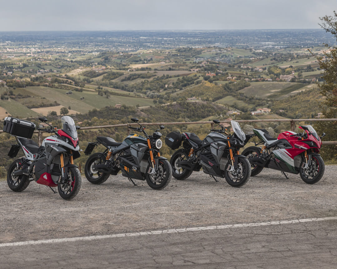 All the energica range parked on a parking area of a hill road