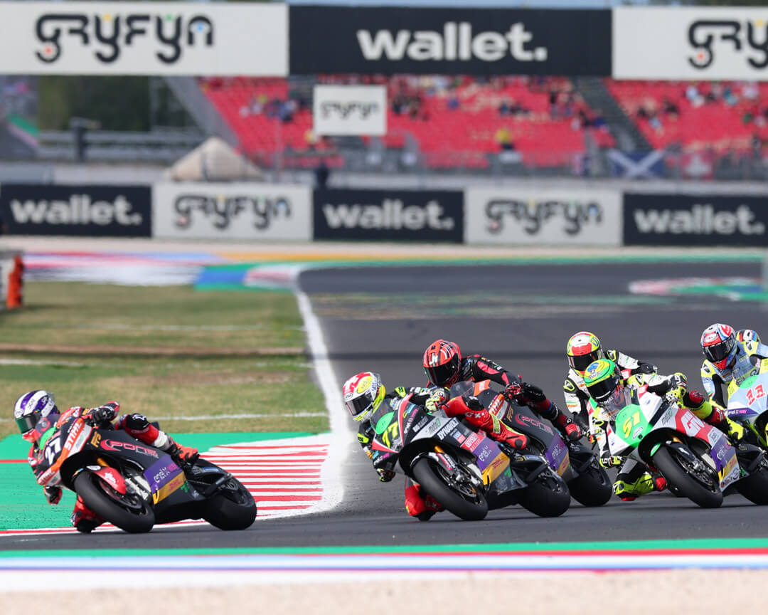 After the start of a racing competition, the various riders and their bikes face the first corner