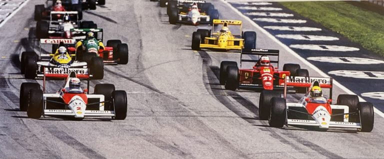 Old color photo taken during a formula 1 grand prix in imola, of the cars just taken from the starting grid