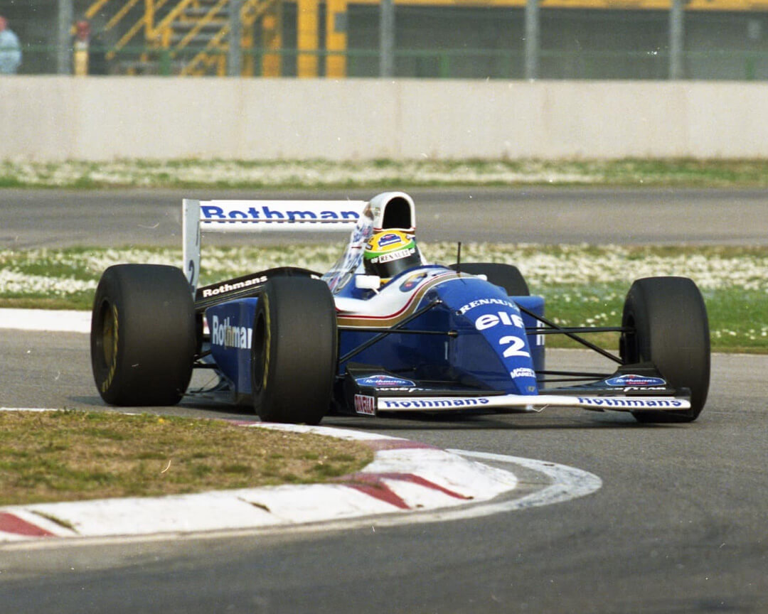 single-seater williams of ayrton senna taking a curve during a formula one gp
