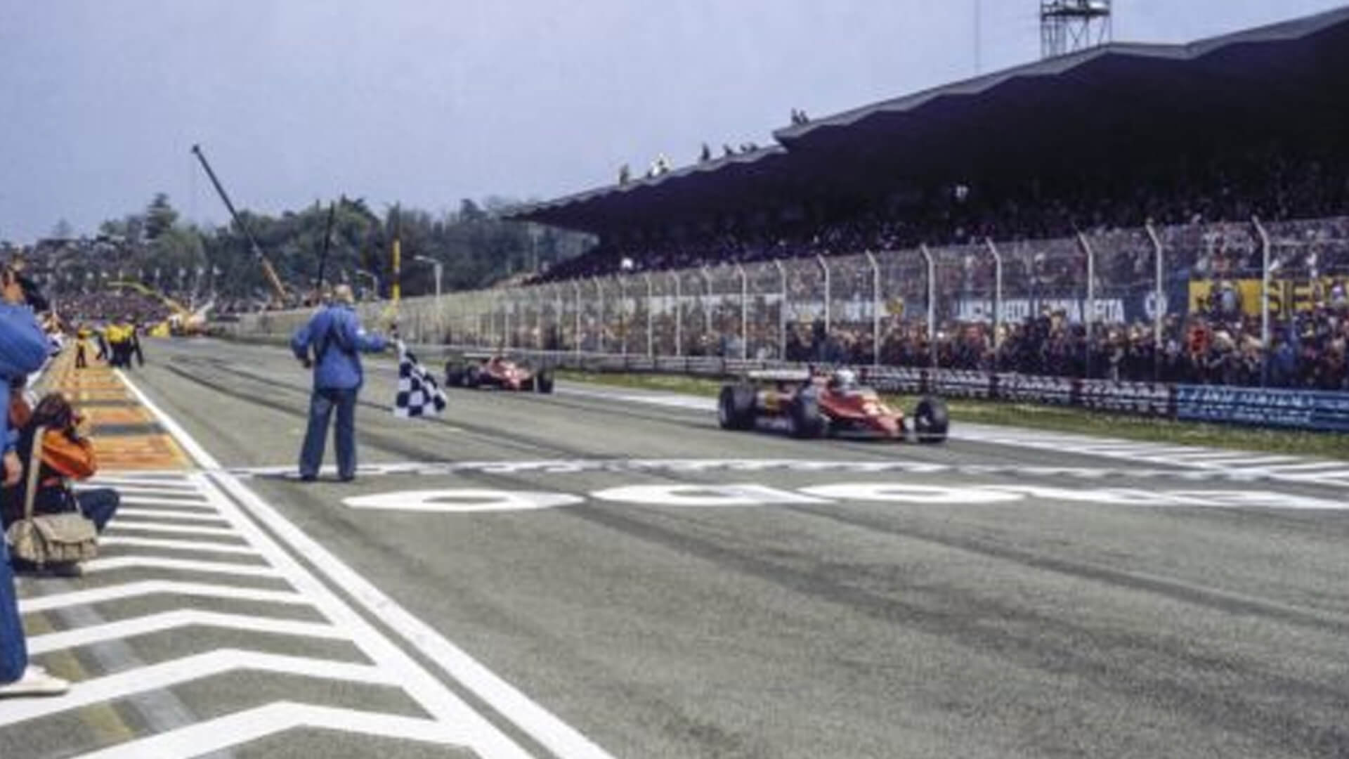 Photo of Pironi precedes Villeneuve at the finish line during a Formula 1 GP at the Imola Autodrome.