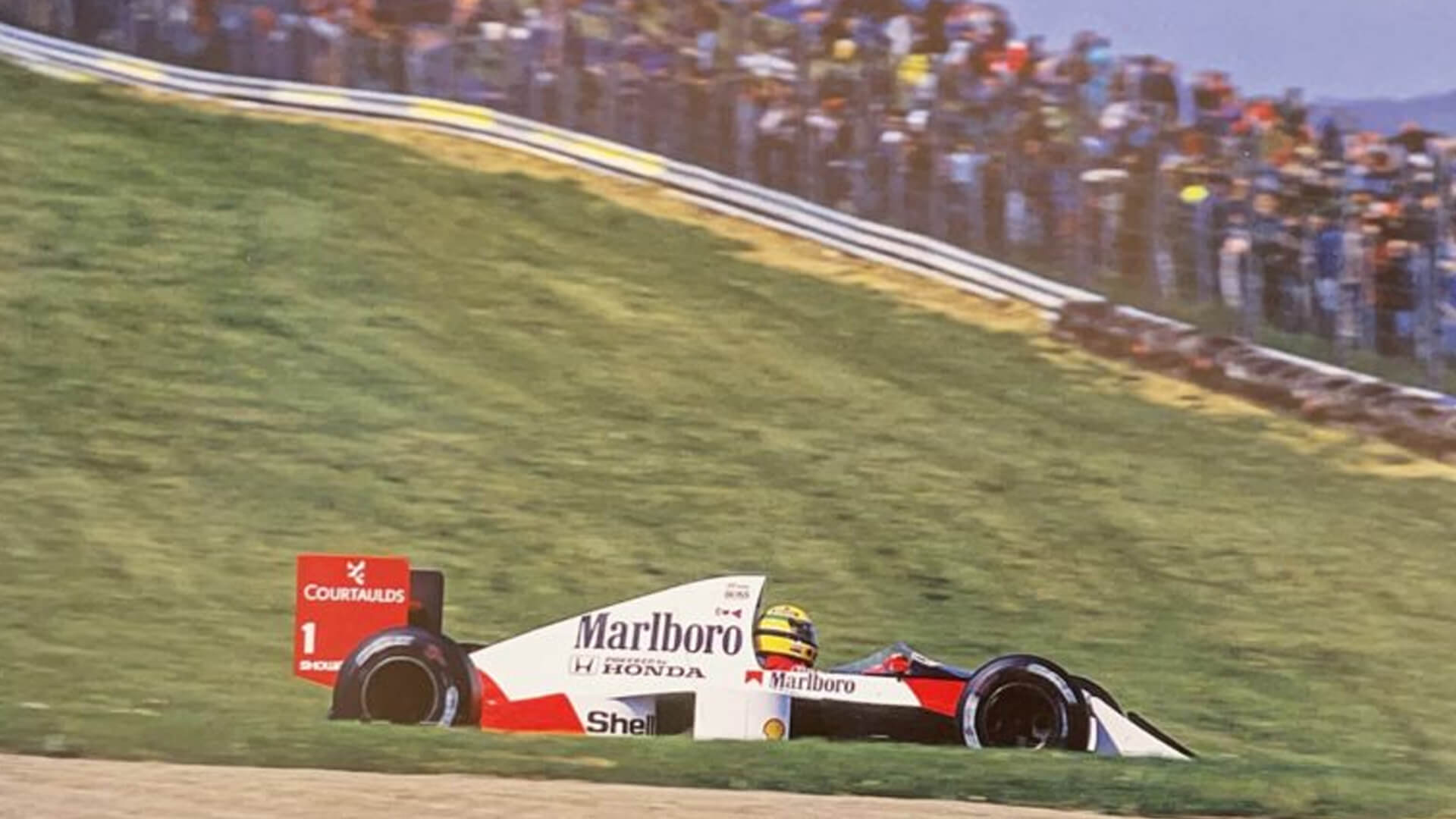 Ayrton Senna on the run to his second victory on the imola circuit
