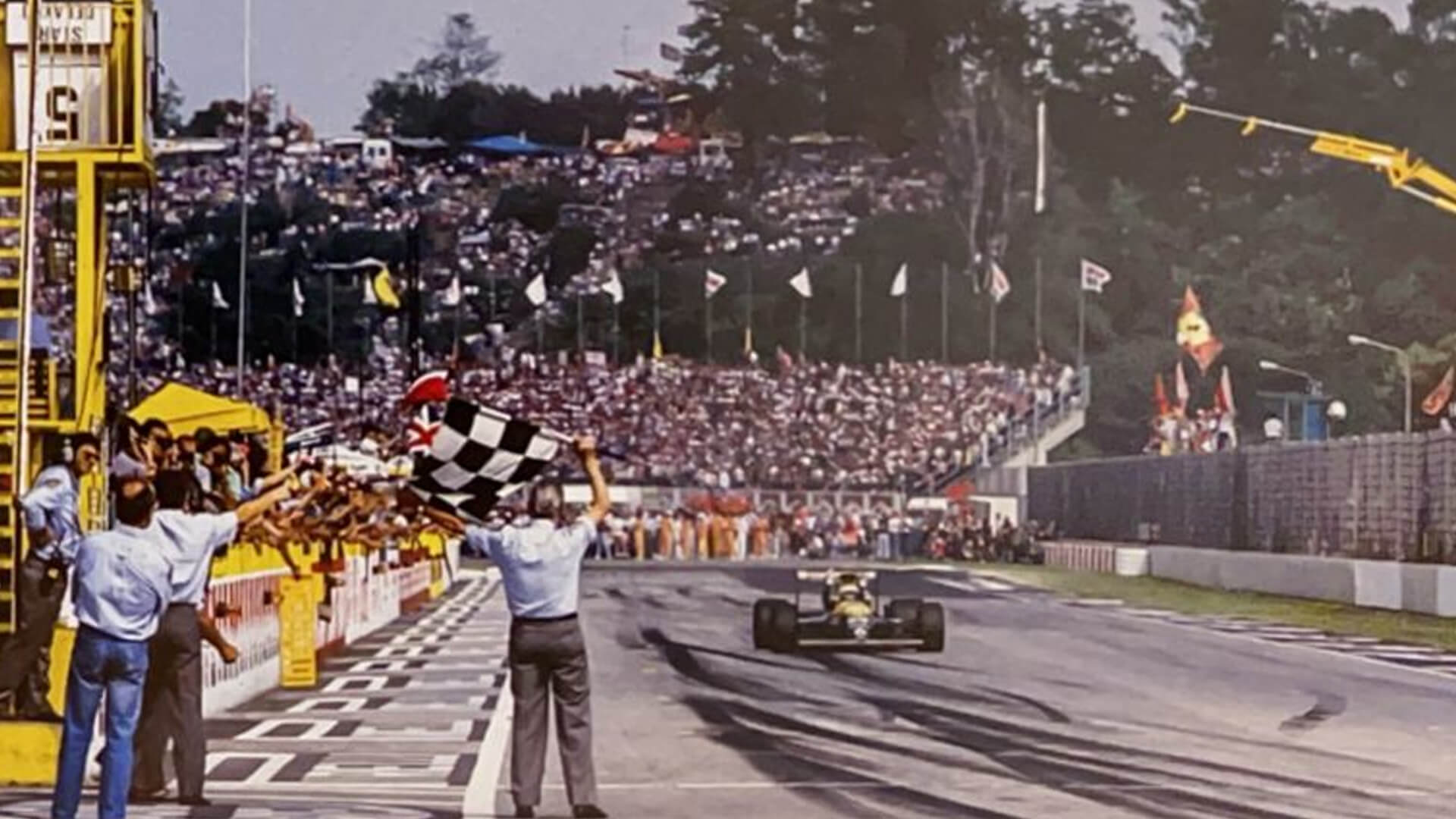 Riccardo Patrese crosses the finish line first in his Renault-powered Williams FW 138 at the conclusion of the Imola grand prix.