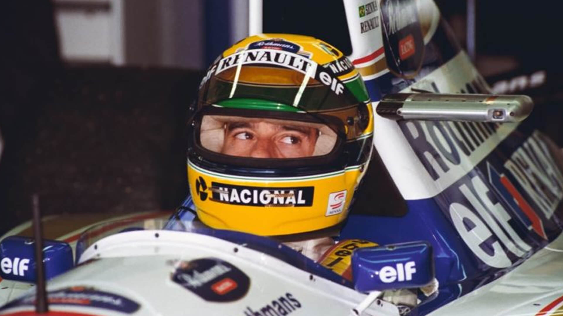 Ayrton senna who inside his single-seater, and with his helmet on looks around