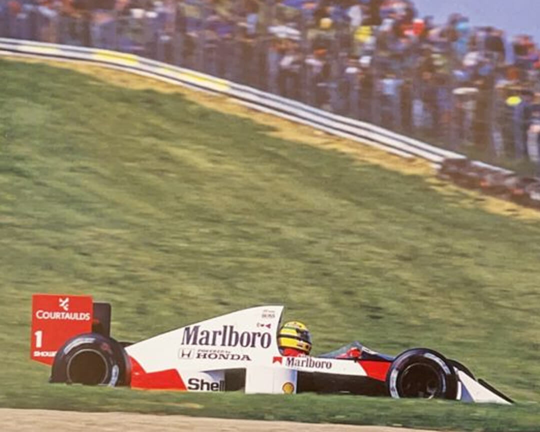 Ayrton Senna on the run to his second victory on the imola circuitla