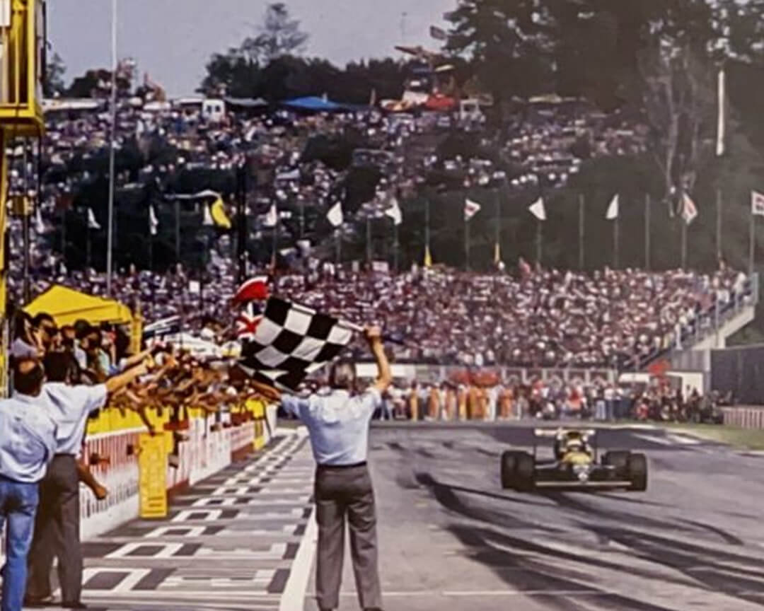 Riccardo Patrese crosses the finish line first in his Renault-powered Williams FW 138 at the conclusion of the Imola grand prix.
