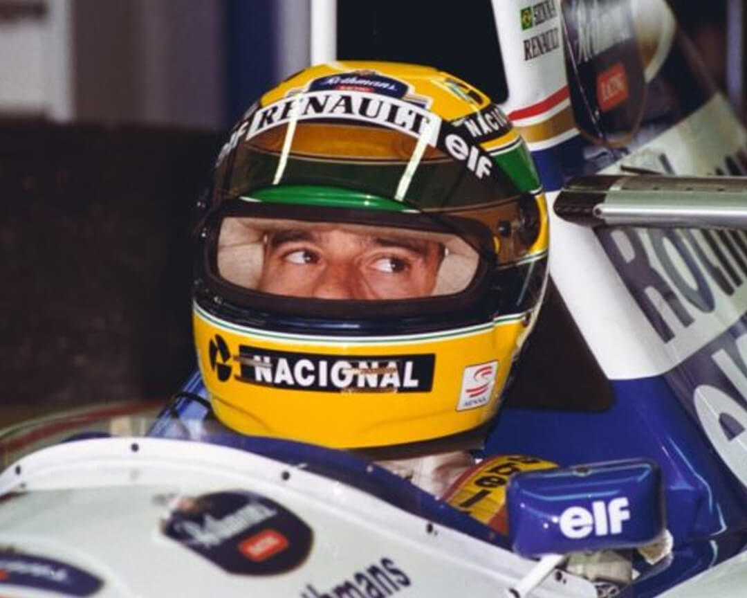 Ayrton senna who inside his single-seater, and with his helmet on looks around