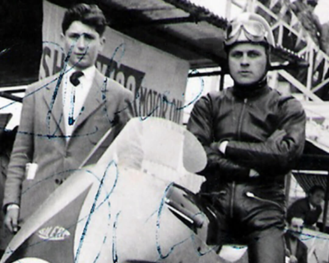 a young doctor Costa alongside a motorcycle driver in one of the first races of the circuit of Imola