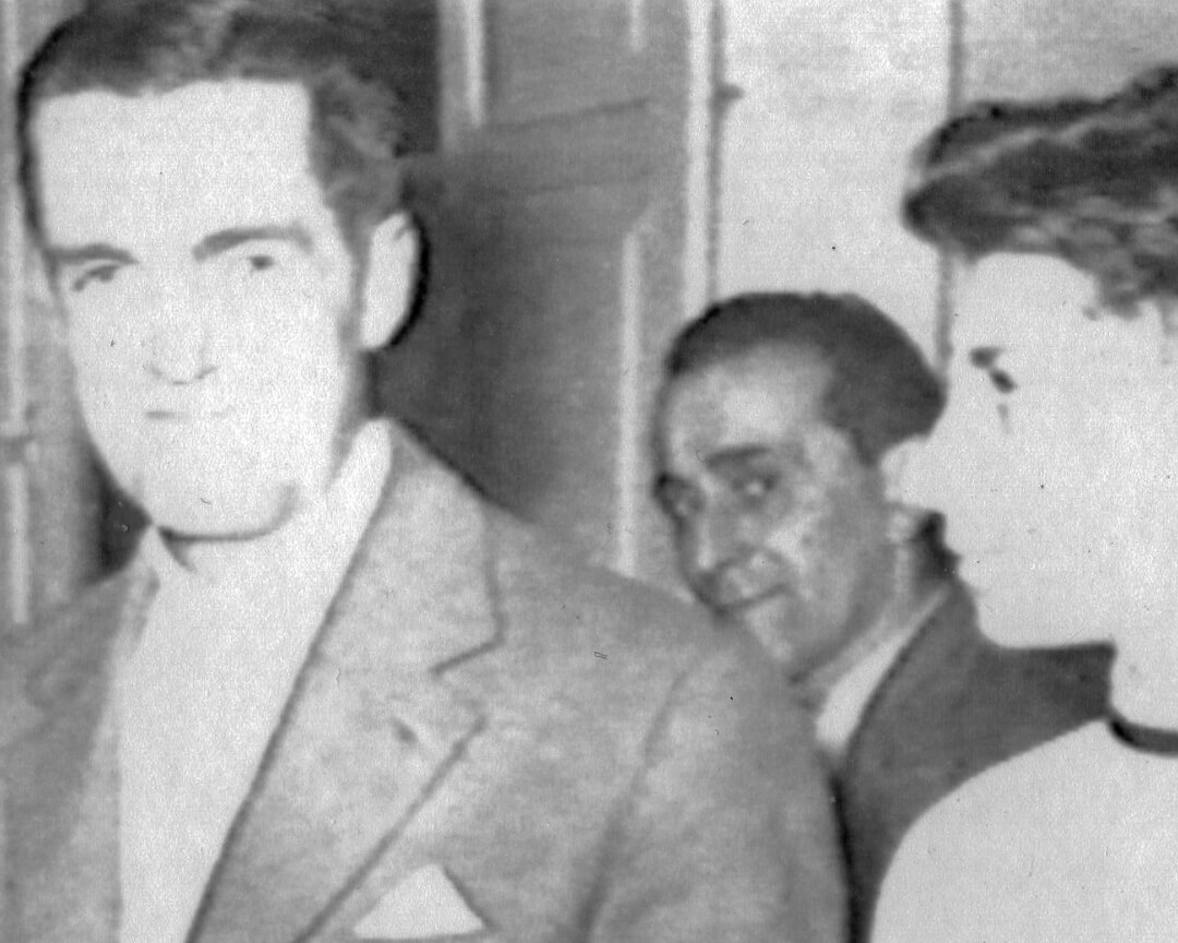 a young doctor Costa beside his father Claudio Costa in a black and white vintage photo