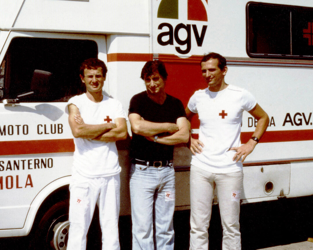 vintage photo of Dr Costa standing in front of the mobile clinic camper with two nurses dressed in white
