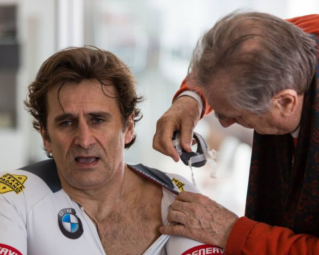 Dr Costa medicating Alex Zanardi’s shoulder in a post race