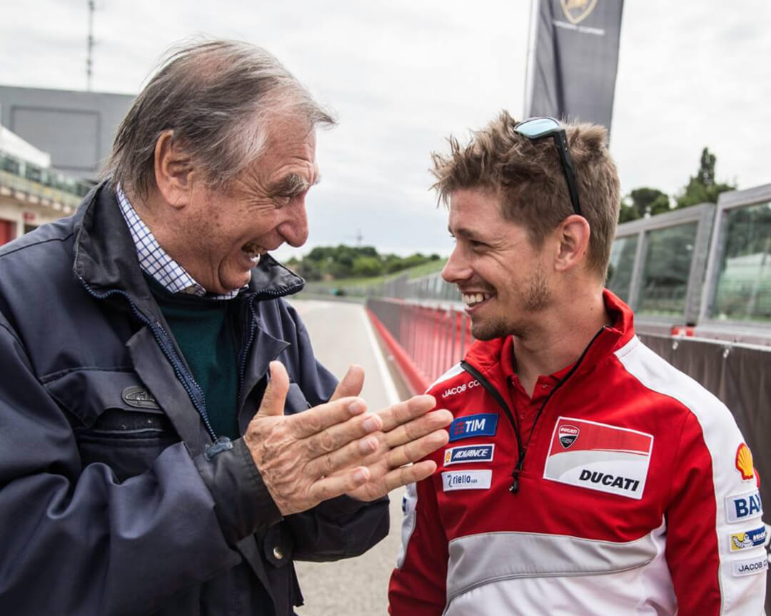 Dr Costa talking to Casey Stoner in the paddock of Imola